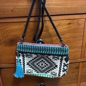 Stylish Black and White Crossbody Bag with Blue Accent